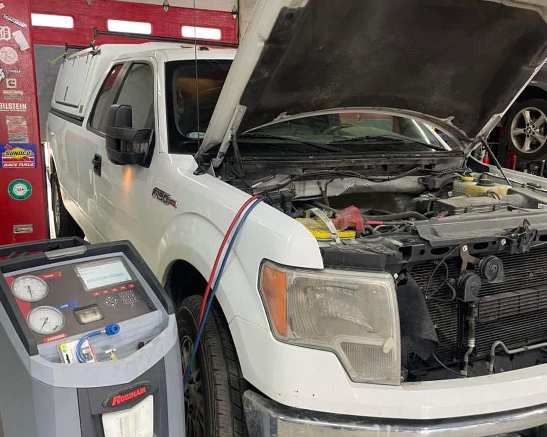 Ford F-150 hooked up to the A/C machine